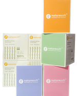 Collection of Naturesoft toilet paper boxes in various colors on a white background