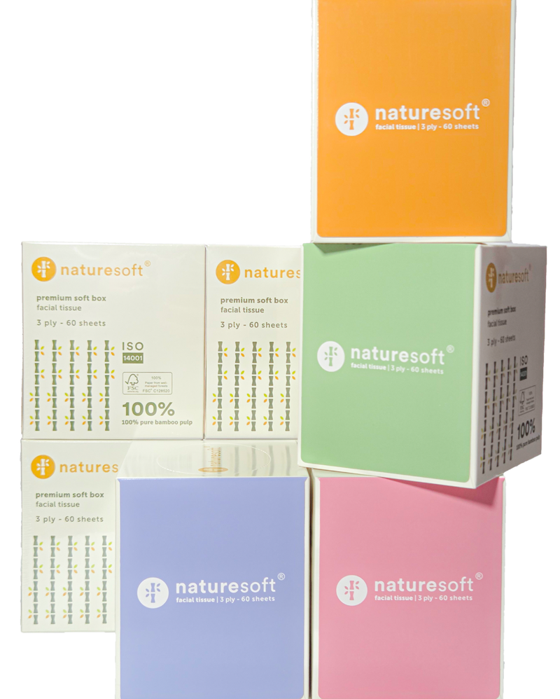 Collection of Naturesoft toilet paper boxes in various colors on a white background